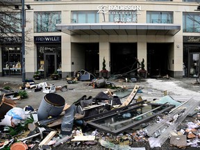 Debris lies in front of the Radisson Blu hotel, where a huge aquarium located in the hotel's lobby burst on December 16, 2022 in Berlin.