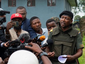 Willy Ngoma, spokesman for the Congolese M23 rebels, addresses the media as they withdraw from the 3 antennes location in Kibumba, near Goma, North Kivu province of the Democratic Republic of Congo, December 23, 2022.