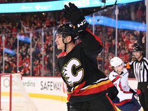 Dec 3, 2022; Calgary, Alberta, CAN; Calgary Flames forward Adam Ruzicka (63) celebrates his goal against the Washington Capitals in the third period at the Scotiabank Saddledome.