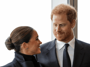 Prince Harry, with his traditional shaggy and unkempt hairdo, and Meghan in September 2021.