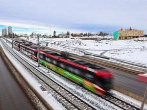 A CTrain heads west towards the Westbrook Communities and past the underdevelopment Crown Park project on Thursday, December 8, 2022. Calgary city council is currently looking at a local area plan for the Westbrook Communities.