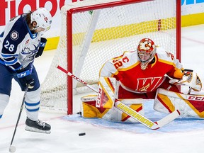 Calgary Flames puck-stopping prospect Dustin Wolf now leads the American Hockey League in wins, with a dozen. He owns a 12-3 record so far in 2022-23.