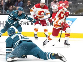 Calgary Flames forward Elias Lindholm fires a shot against the San Jose Sharks during the third period on Sunday.