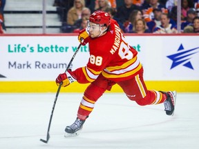 Calgary Flames left wing Andrew Mangiapane (88) shoot the puck against the Edmonton Oilers during the second period at the Scotiabank Saddledome on Dec. 27, 2022.