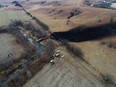 In this photo taken by a drone, cleanup continues in the area where the ruptured Keystone pipeline dumped oil into a creek in Washington County, Kan., Friday, Dec. 9, 2022.