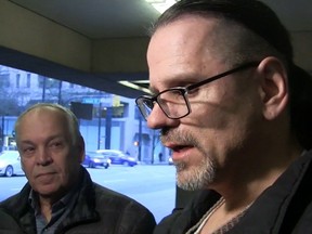 Wade Skiffington is seen speaking to reporters beside his father, Tom, left, in a still frame taken from video footage outside of court in Vancouver on January 23, 2019.