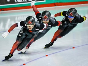 From left, Canada’s Antoine Gelinas-Beaulieu, Christopher Fiola and Laurent Dubreuil skate to a bronze medal during the men’s team sprint competition at the ISU World Cup speed skating event at the Olympic Oval in Calgary on Friday, Dec. 16, 2022.