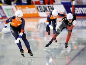 Ivanie Blondin of Canada, right, and Irene Schouten of the Netherlands cross the finish line during the women’s mass start competition at the ISU World Cup speed skating event at the Olympic Oval in Calgary on Sunday, Dec. 18, 2022. Schouten won while Blondin finished second.