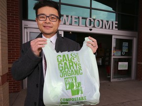 Jerry Gao, founder of LEAF Environmental Products Inc. poses with a compostable bag in front of a Co-op location in southwest Calgary on Thursday, January 26, 2023.