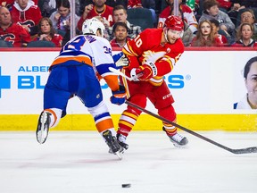 Calgary Flames forward Jonathan Huberdeau (10) shoots the puck against the New York Islanders during the second period at the Scotiabank Saddledome on Jan. 6, 2023 in Calgary.