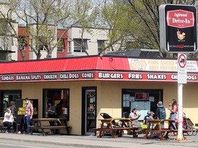 FILE PHOTO: People are seen enjoying a warm afternoon and a cool treat outside The Inglewood Drive-In. Saturday, May 29, 2021.