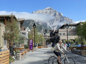 Visitors enjoy Bear Street's new pedestrian-friendly design in downtown Banff.