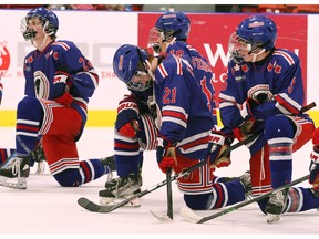 The Calgary Buffaloes show emotion after losing the championship game 6-0 to the South Alberta Hockey Academy during the Circle K Classic’s finale Sunday at Max Bell Centre. Jim Wells/Postmedia