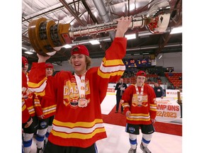Players of the South Alberta Hockey Academy celebrate after winning the championship during the Circle K Classic’s championship game Sunday at Max Bell Centre. Jim Wells/Postmedia