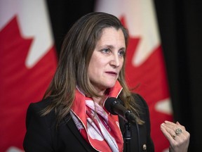 Minister of Finance and Deputy Prime Minister Chrystia Freeland speaks to the media at the Hamilton Convention Centre, in Hamilton, Ont., on Tuesday, January 24, 2023. The federal government failed to spend tens of billions of dollars in the last fiscal year on promised programs and services, including new military equipment, affordable housing and support for veterans.