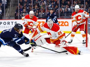 Winnipeg Jets forward Axel Jonsson-Fjallby shoots on Calgary Flames goaltender Jacob Markstrom at Canada Life Centre in Winnipeg on Tuesday, Jan. 3, 2023.