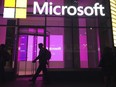 People walk past a Microsoft office in New York, Nov. 10, 2016.