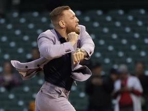 MMA fighter Conor McGregor throws out a ceremonial first pitch before a baseball game on Sept. 21, 2021, in Chicago.