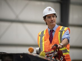 Prime Minister Justin Trudeau tours the Vital Metals rare earth elements processing plant in Saskatoon during a media event on Monday, Jan. 16, 2023. Saskatchewan Premier Scott Moe says the Prime Minister's Office has apologized for leaving him off the invite list.