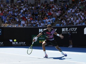 Felix Auger-Aliassime of Canada plays against Jiri Lehecka of the Czech Republic during their fourth round match at the Australian Open tennis championship in Melbourne, Australia, Sunday, Jan. 22, 2023.