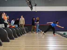 People bowl at YYC Bowling and Entertainment on Thursday, February 23, 2023.