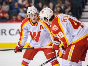Calgary Wranglers forward and AHL goal-scoring leader Matthew Phillips, left, is pictured with Jakob Pelletier.