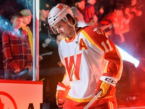 Calgary Wranglers' Matthew Phillips enters the ice for a game against the Coachella Valley Firebirds at the Scotiabank Saddledome on Sunday, October 16, 2022.