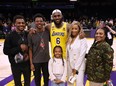 LeBron James #6 of the Los Angeles Lakers poses for a picture with his family at the end of the game, (L-R) Bronny James, Bryce James, Zhuri James Savannah James and Gloria James, passing Kareem Abdul-Jabbar to become the NBA's all-time leading scorer, surpassing Abdul-Jabbar's career total of 38,387 points against the Oklahoma City Thunder at Crypto.com Arena on February 07, 2023 in Los Angeles.