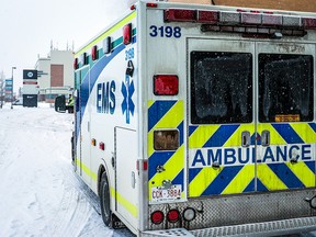 An AHS ambulance waits outside the emergency entrance at the Peter Lougheed Centre in Calgary on Tuesday, February 28, 2023.