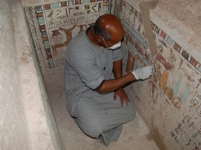 An Egyptian employee works at the 4,000-year-old tomb of Meru, the oldest site accessible to the public on Luxor's West Bank February 9, 2023.