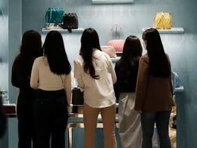 Women shop at a department store in Seoul, South Korea, May 1, 2020.