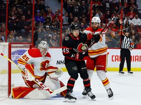 No panic in Flames lineup, despite lack of third-period comebacks Flames defenceman Noah Hanifin attempts to box out Ottawa Senators forward Parker Kelly during Monday’s game.