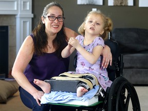 Mom Amanda Levesque and her daughter Ariana, who has a rare condition called GNB1, in Calgary on Sunday, February 26, 2023.