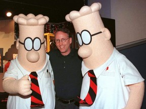 Scott Adams, the creator of "Dilbert", the cartoon character that lampoons the absurdities of corporate life, poses with two "Dilbert" characters at a party in Pasadena, Calif., Jan. 8, 1999.