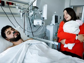 Mustafa Avci, 33, who was stuck under rubble for 261 hours, meets his daughter Almile for the first time and reunites with his wife Bilge, following the deadly earthquake, at a hospital in Mersin, Turkey, Feb. 17, 2023. Almile was born on the day of the earthquake.
