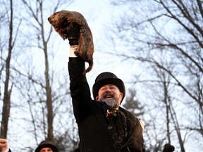 AJ Dereume holds up Phil the groundhog as he is to make his prediction on how long winter will last during the Groundhog Day Festivities, at Gobblers Knob in Punxsutawney, Pennsylvania, U.S., February 2, 2023.