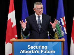 Finance Minister Travis Toews discusses the Alberta 2023 Budget during a press conference in Edmonton, Tuesday Feb. 28, 2023.