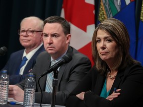 Dr. John Cowell, Health Minister Jason Copping and Premier Danielle Smith provided updates on the work underway to reduce wait times and improve patient care in Alberta during a press conference at the McDougall Centre in Calgary on Monday, Feb. 27, 2023.