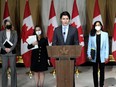 Prime Minister Justin Trudeau is joined by Minister of Foreign Affairs Melanie Joly, left, Deputy Prime Minister and Minister of Finance Chrystia Freeland, and Minister of National Defence Anita Anand, right, as he speaks during a media availability on the situation in Ukraine, in Ottawa, Feb. 22, 2022.