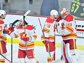 Feb 22, 2023; Tempe, Arizona, USA; The Calgary Flames celebrate after defeating the Arizona Coyotes at Mullett Arena. Mandatory Credit: Matt Kartozian-USA TODAY Sports