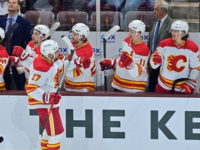 Calgary Flames left winger Milan Lucic celebrates with teammates after scoring a goal in the first period against the Arizona Coyotes at Mullett Arena.