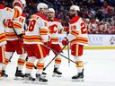 Feb 11, 2023; Buffalo, New York, USA;  Calgary Flames center Dillon Dube (29) celebrates his goal with teammates during the third period against the Buffalo Sabres at KeyBank Center. Mandatory Credit: Timothy T. Ludwig-USA TODAY Sports