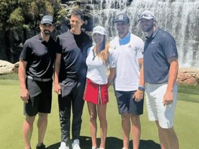 Aaron Rodgers, Tom Brady, Sara King, Patrick Mahomes and Josh Allen posing in front of waterfall.