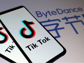 TikTok logos are seen on smartphones in front of a displayed ByteDance logo in this illustration taken Nov. 27, 2019.