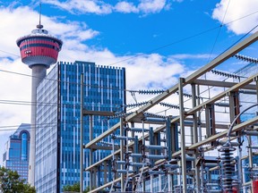 Enmax power lines are seen with Calgary skyline as a backdrop on Tuesday, August 16, 2022.