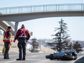 Calgary Police investigating at the scene of a fatal motorcycle accident on Macleod Trail by 31 Ave. S.W. on Friday, March 31.