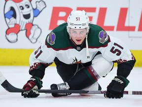 Troy Stecher of the Arizona Coyotes stretches prior to the game against the Chicago Blackhawks at United Center on Feb. 10, 2023 in Chicago, Illinois.