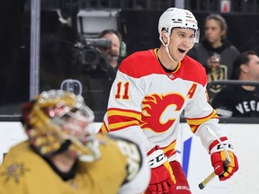 LAS VEGAS, NEVADA - MARCH 16: Mikael Backlund #11 of the Calgary Flames reacts after scoring a third period power play goal against Jonathan Quick #32 of the Vegas Golden during their game at T-Mobile Arena on March 16, 2023 Knights scored in Las Vegas, Nevada.  The Flames defeated the Golden Knights 7-2.