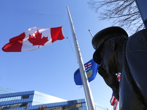 Flags at Calgary's city hall were at half-mast to honour two Edmonton police officers killed in the line of duty on Thursday, March 16, 2023.