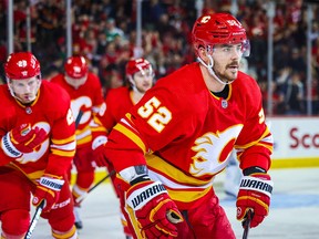 Calgary Flames defenceman MacKenzie Weegar (52) celebrates his goal with teammates against the Dallas Stars during the second period at the Scotiabank Saddledome in Calgary on March 18, 2023.